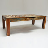 a wooden bench sitting in the snow